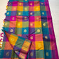 Rangoli Kattam – Pure Silk Kanchipuram Saree
Vibrant multicolor kattam checks with golden zari buttas across the body
Rich rani pink pallu with intricate zari weaving for a grand finish
Contrast purple borders edged with gleaming zari motifs