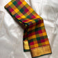 Draped Paalum Pazhamum checked silk saree showing mustard, green and maroon kattam with gold zari border