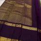 Iravati – Earthy Green Kanchipuram Pure Silk Saree
A graceful weave in a rare earthy green tone, adorned with gold zari kattam and butta.
Accented by a rich plum rettapet border with delicate flower vine motifs.