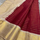 Full view of red striped Kanchipuram silk pallu with intricate gold zari and tassels