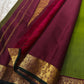 Varnam – Leaf Green Pure Kanchipuram Silk Saree with Gold Zari Buttas, Trellis Design Arakku Border, and Contrast Maroon Zari Pallu