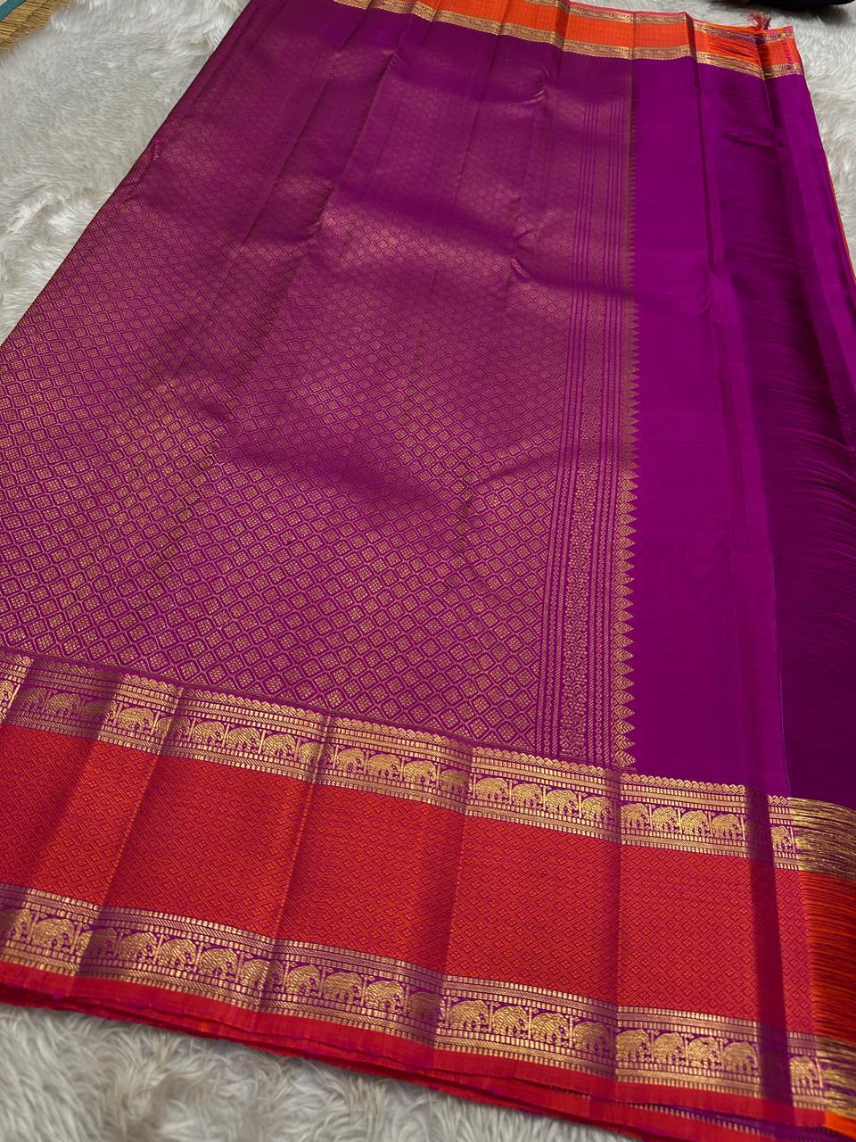 Suryarekha – Pure Korvai Kanchipuram Silk Saree
Kesari-Orange & Pink dual-tone body with gold paisley buttas
Arakku Red korvai border with diamond brocade elephant  motifs
Vadamalli Purple grand zari brocade pallu | shios in 2 weeks ,silk mark cer