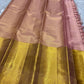 Varnika – Handwoven Kanchipuram Silk Saree in Rose Gold Pink
Graceful and radiant, this rose gold pink Kanchipuram silk saree features delicate gold zari paisleys and Gandaberunda motifs.