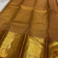 Bronze Chakram — Kanchipuram Pure Silk

Warm caramel-brown body with grid checks & “chakram” buttas

Grand gold zari peacock border & glowing pallu (kaddi + paisley vine)

Silk Mark Certified | Free Shipping within USA

Dispatch in 1 Week
