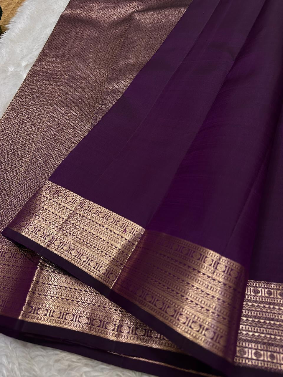 Vibha plum - A Deep Plum Pure Kanchipuram Silk Saree Blending the Grandeur of South Indian Weaving with Paithani-Inspired Floral Zari Borders and a Lustrous Rose Gold zari Pallu