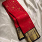 Vermilion red meets classic black. Fine kattam checks with coin buttas, peacock-zari borders and a regal black brocade pallu—made for Diwali lights, vows, and heirloom moments. Silk Mark Certified • Dispatch in 1 week • Free USA Shipping