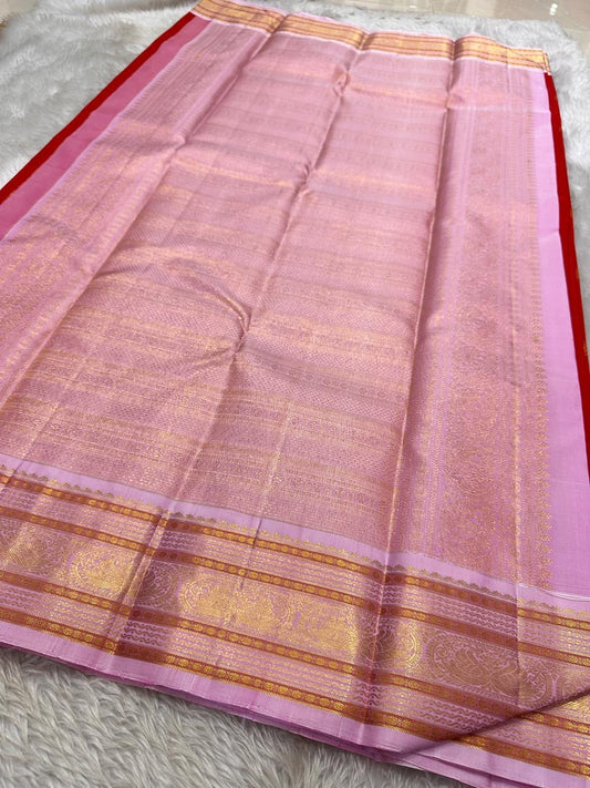 Pure silk flaming cherry red and pastel pink with Zari woven buttas and woven varisaipet Mayil border in pastel pink