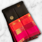 Kanmani — Black & Rani Pure Silk Kanchipuram Saree
Inky black body with gold medallion & peacock buttas
Striking rani-pink and kavi-orange korvai borders with temple-edge zari
Rich rani-pink brocade pallu with grid jaal & heritage vines
Silk Mark Cert
