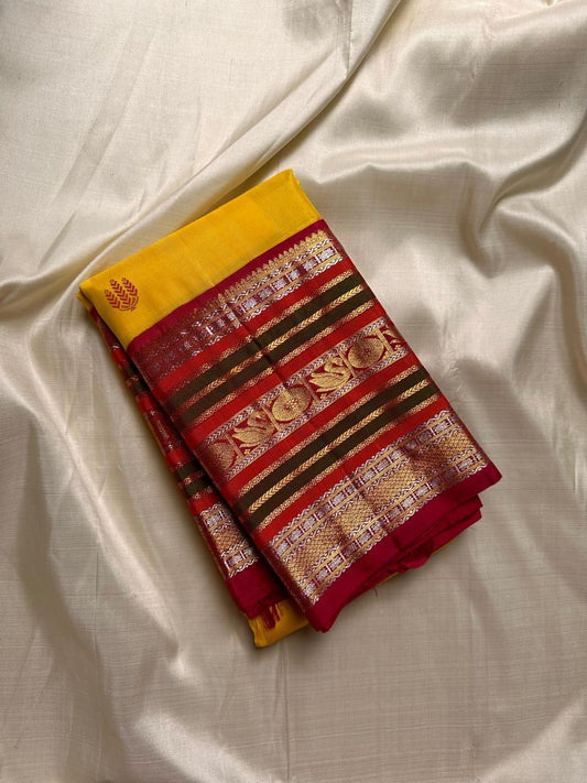 Bhavya – Mustard & Maroon Kanchipuram Pure Silk Saree
Featuring Lotus & hamsa  Motifs in Luxurious Sonaroopa Zari
A Timeless Elegance Woven for Celebrations and Special Moments