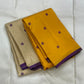 Manjal Vadamalli Chakram – Pure Kanchipuram Silk Saree

Marigold yellow body with purple floral thread buttas

Grand royal purple pallu with gold medallion zari & reku-style stripes

Handwoven Double Warp Weave | Silk Mark Certified | Fall & Pico Done