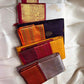 Jamun Purple Kesar – Korvai Kanchipuram Pure Silk Saree

Regal jamun-purple body adorned with antique-gold floral buttas

Kesari-orange korvai border with chakra roundels, vines & chevron zari

Free shipping withinUSA silk mark certified ships in 2 weeks