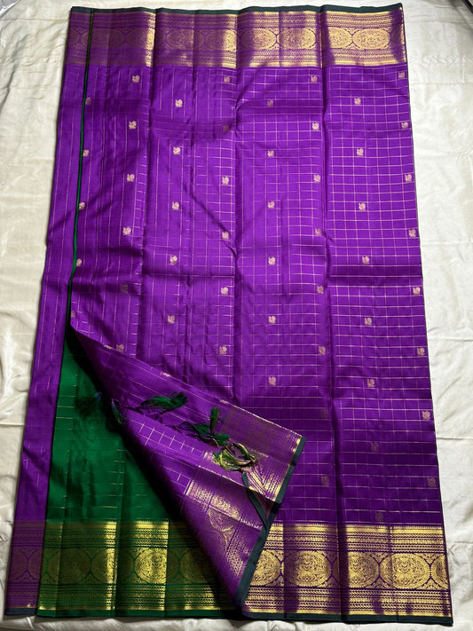 Sunanda – Royal Purple Pure Kanchipuram Silk Saree with Zari Checked Buttas & Majestic Sorgavaasal Mayil Peacock Medallion Temple Border