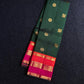 Varna Jaalam Green — Pure Silk Kanchipuram
Bottle-green body with gold chakram & mayil buttas, korvai pink-orange border
Silk Mark Certified • Free USA Shipping • Ships in Two Weeks ✅