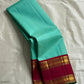 Neer Pachai Vairaoosi — Kanchipuram Pure Silk saree 

Sea-foam/aqua body with classic Vairaoosi pinstripes

Contrast ruby-maroon korvai borders with gold chakram & floral panels

Grand maroon pallu with all-over chakram jaal and paisley vines; aqua tassel