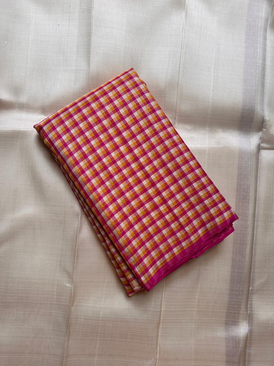 Mutyam – Handwoven Borderless Kanchipuram Pure Silk Saree with Traditional Paalum Pazhamum Baby Checks or kasa kasa kattamDual Contrast Green & Pink Selvedges, and a Subtle Zari Woven Pallu, silk mark certified, ships in two weeks