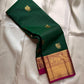 Maragatha Mayil Butta — Kanchipuram Pure Silk

Emerald green (maragatham) body with gold mayil/peacock buttas

Contrast rani-magenta korvai borders & zari-rich pallu

Silk Mark Certified | Free Shipping within USA