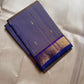Indigo Vanki Ilai Butta – steel-lilac body with royal-blue korvai borders

Pure Kanchipuram silk • scattered gold ilai (leaf) buttas on a dual-tone base

Royal-blue brocade pallu with multi zari stripes & bold chevron (vanki) panels • contrast blouse