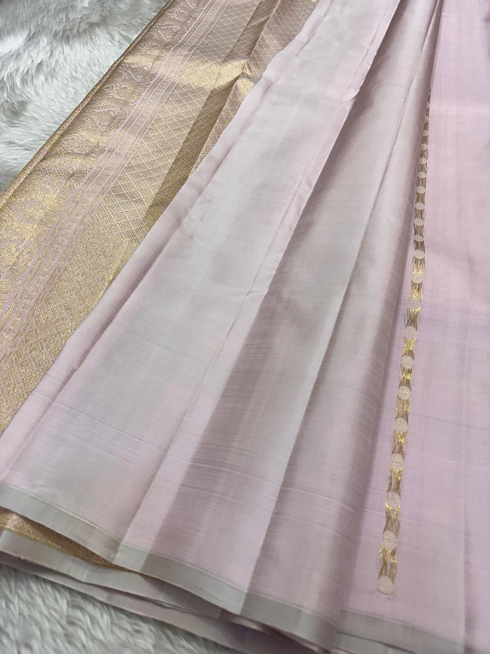 The daintiest blush pink with zari coin buttas in gold and silver pure silk Kanchipuram saree