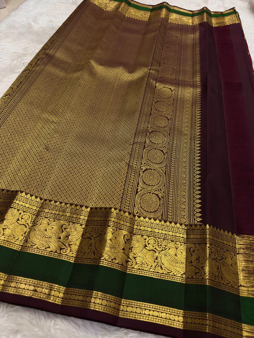 Vanasringaram pallu on arakku red handwoven Kanchipuram pure silk saree — Idam Living