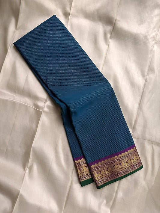 pure Silk teal and blie  stripes mayil Border with green selvedge . Ornate Pallu with , mayil and kamalam butta