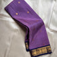 Lilac Mayil Pushpam – lilac-purple body with navy korvai borders

Pure Kanchipuram silk • gold zari pushpam (flower) buttas all over

Grand navy brocade pallu with diamond jaal • contrast blouse with border

Silk Mark Certified | Fall & Pico Done |