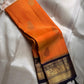 Pure Kanchipuram Silk Saree – Saffron-Orange Body with Gold Zari Paisley Buttas
Contrast Deep Purple Korvai Borders with Intricate Temple & Floral Motifs
Grand Purple Zari Pallu with Diagonal zariWeave . Silk mark , ships in 2 weeks