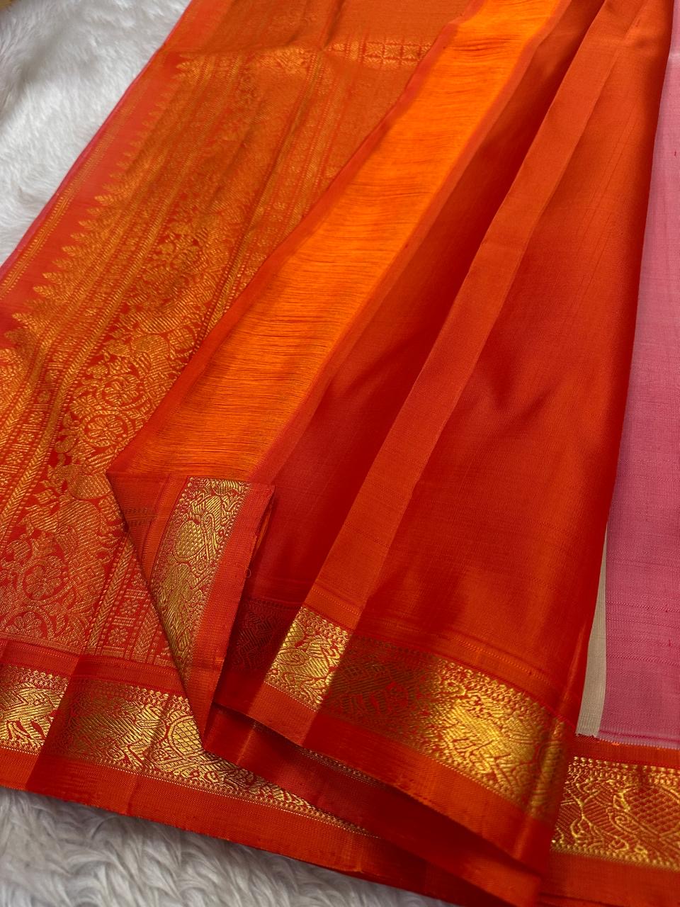 Amber Shubhra Butta — Pure Kanchipuram Silk Saree
Ivory body with golden zari buttas and vibrant amber-orange pallu
Pure 3gm zari • Silk Mark Certified • Free Shipping within USA