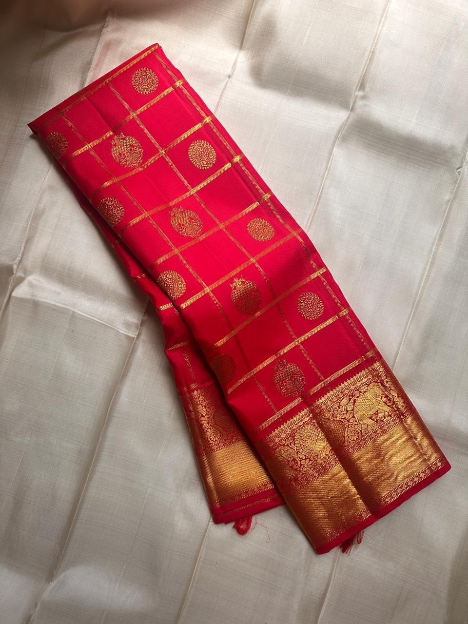 Srija – Red-Orange zari kattam  Kanchipuram Pure Silk Saree with Zari Checks, Kamalam Buttas & Vanasringaram Border