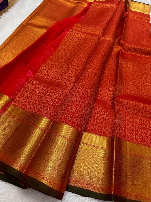 Kirtan ✨ – Vermilion Red Kanchipuram Pure Silk Saree
with Intricate Gold Zari Kattam Checks
Broad Lustrous Golden Border with Green Selvedge 🌿
Grand Radiant Pallu in Red & Gold Weaves
An Heirloom of Tradition, Festivity & Grace