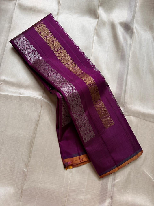 Lavanya– radiant purple Handwoven Kanchipuram Silk Saree in purple with Gold & Silver Zari, this deep purple Kanchipuram silk saree with intricate motifs in gold and silver zari, including Gandaberunda, parrots, elephants &lotuses as seen on Nita Ambani
