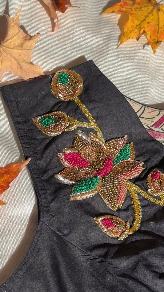 Black Silk Cotton Blouse. Hand-embroidered floral pattern in pink, green, copper, and gold