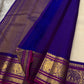 ⸻

Ivory Glow ✨ – Pure Kanchipuram Silk Saree in Ivory

Korvai Royal-Purple Border with Elephant & Peacock Zari Panels; Magenta Selvedge
Body with Gold Coin & Paisley Buttas
Grand Royal-Purple Brocade Zari Pallu with Hand-knotted Tassels