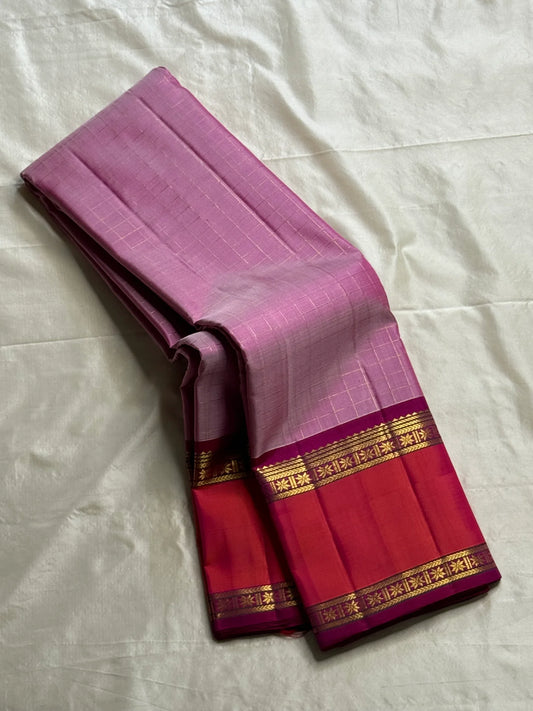 Gulabi Kattam – Pure Kanchipuram Silk Saree
Pastel Pink Body with Fine Zari Grid Checks
Raspberry Korvai Borders with Floral Zari Work
Grand Raspberry–Magenta Brocade Pallu
Silk Mark Certified | Fall & Pico Done | | ships in 2 weeks