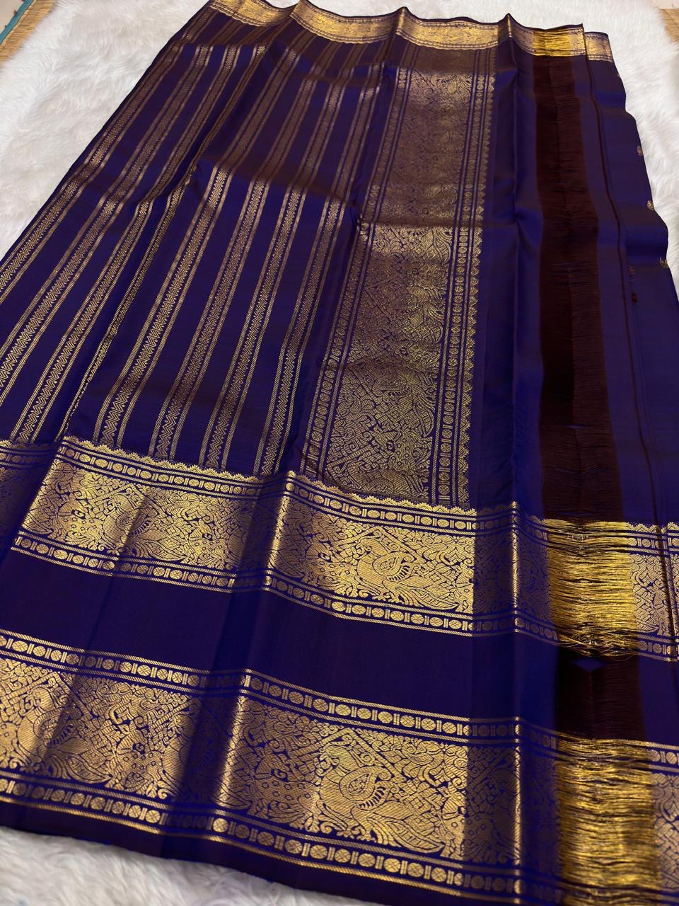 Royal Indigo and Antique Gold Handwoven Pure Silk Kanjeevaram Saree with Rettapet Border and Mayil Chakram Butta