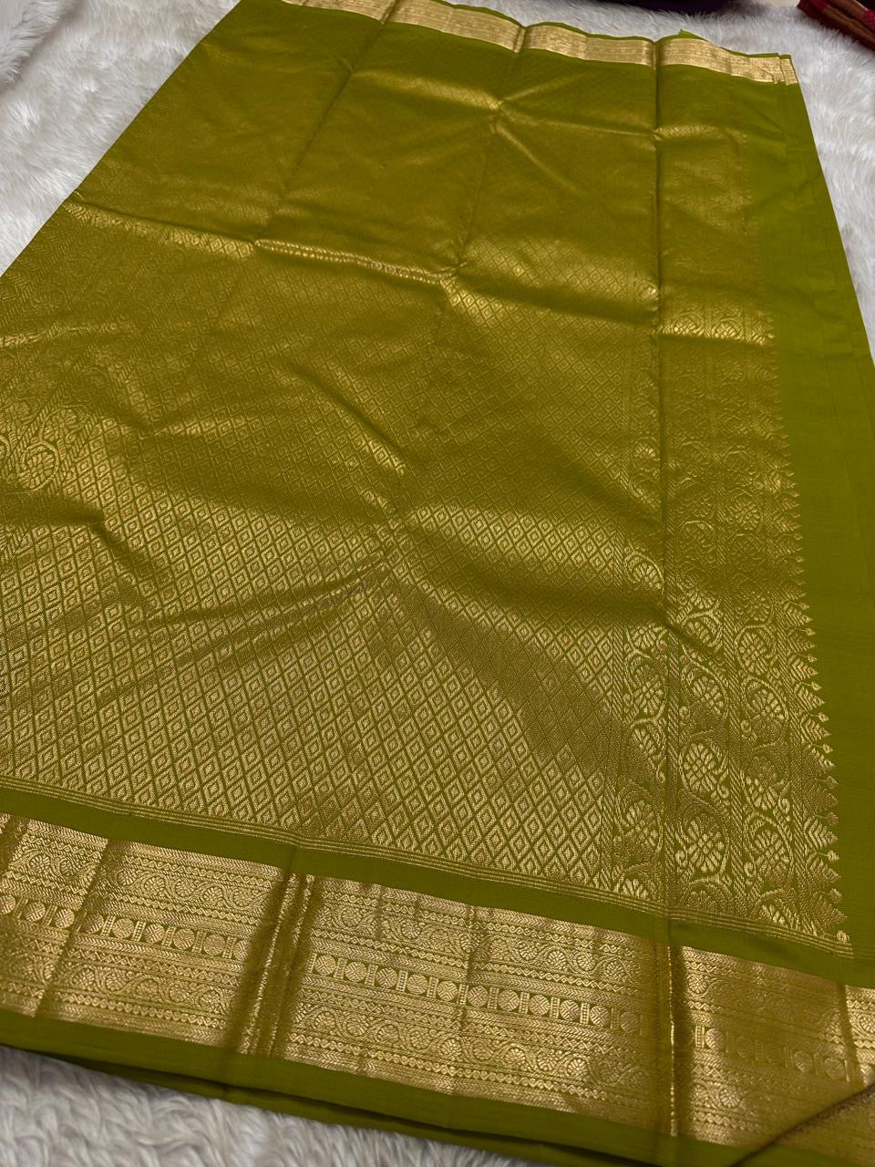Leaf Green — Thamarai — Pure Kanchipuram Silk Saree
Fresh Leaf Green with Gold Zari Lotus Buttas & Diamond Jaal Pallu
Silk Mark Certified • Free Shipping within USA • Ships in Two Weeks
