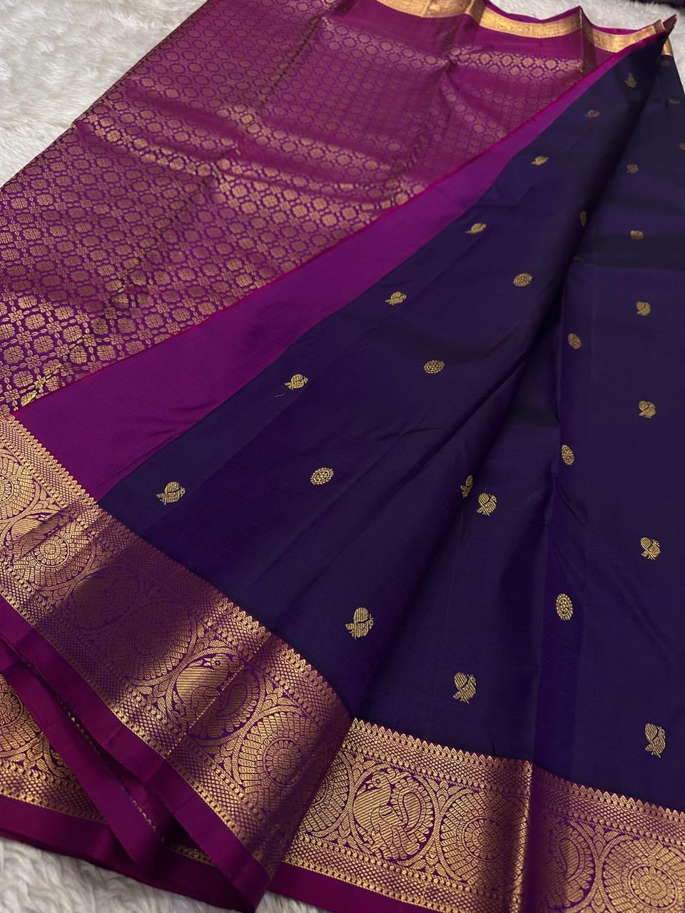 Berry Ruby Kamalam Butta — Pure Kanchipuram Silk
Lotus zari buttas on deep ruby silk with rani korvai border
Silk Mark Certified • Free Shipping within USA • Ships in Two Weeks
