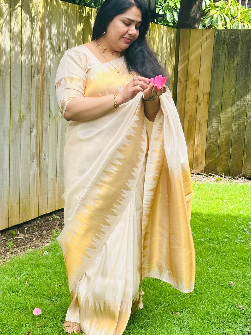 Ivory Glow ✨ – Soft Banarasi Silk Saree
Elegant Ivory Body with Lustrous Sheen
Gold Zari Lightning Border for Festive Radiance
Onam Special Edition – Traditional & Timeless
Silk Mark Certified | Free USA Shipping | Ready to Ship