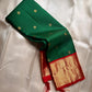 🍃 

Pachai Arakku Chakram — Bottle-Green & Vermilion Kanchipuram


Pure Silk • Silk Mark Certified • Handloom

Bottle-Green Body with Gold Chakram (coin) Buttas

Arakku-Red Korvai Border with Temple-Reku & Broad Tissue Zari • Rich Red Zari Pallū