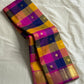 Navaranga Kattam — Multi-Color Paalum pazhamum checks  Kanchipuram Pure Silk

Rani-magenta contrast border & rich zari pallū 

Gold coin & peacock buttas over jewel-tone squares

Handloom Kanchipuram • Matching magenta blouse with borders
