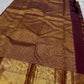 Narrow gold zari temple motif border on deep plum Kanchipuram saree