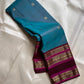 Neelam Jamuna – Pure Kanchipuram Silk Saree

A teal body adorned with glowing zari buttas.

Wine korvai border detailed with antique-gold.

A majestic jamuna pallu rich in brocade artistry.

Silk Mark Certified, delivery in 2 weeks