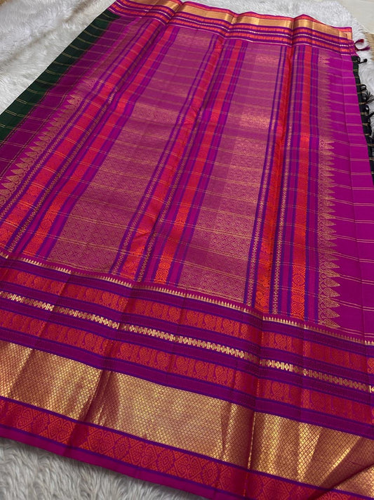 Emerald Blossom ✨ – Pure Kanchipuram Silk Saree
Bottle-Emerald Green Body with Zari Checks & Buttas
Korvai Rani-Pink & Purple Contrast Border with Rich Zari
Grand Rani-Pink Brocade Pallu with Temple motifs , Silk Mark Certified, delivery in 2 weeks