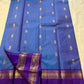 Azure Blue Purple Horizon – Neelam blue body with royal-purple korvai borders  Pure Kanchipuram silk • manga (paisley) buttas + fine pin-stripes  Opulent purple brocade pallu • contrast blouse with zari border  Silk Mark Certified | Fall & Pico Done |