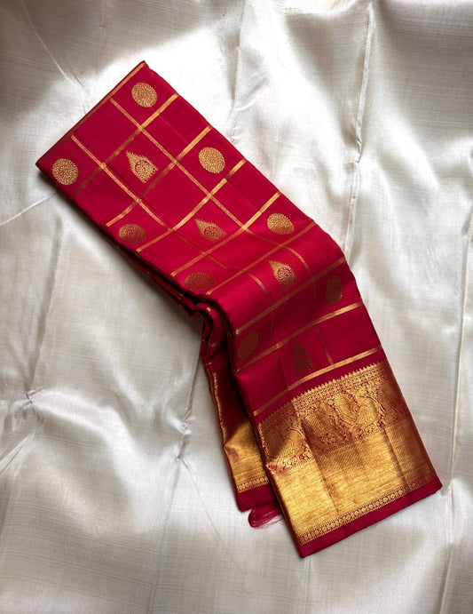 Leelavati Kattam Red
Kumkum-Red Kanchipuram Silk Saree
Zari Kattam Checks & Elephant Procession Border