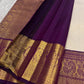 Ivory silk meets tradition in this elegant Kanchipuram saree. With a deep purple border and Mayuri motifs, it’s perfect for moments that call for quiet richness.