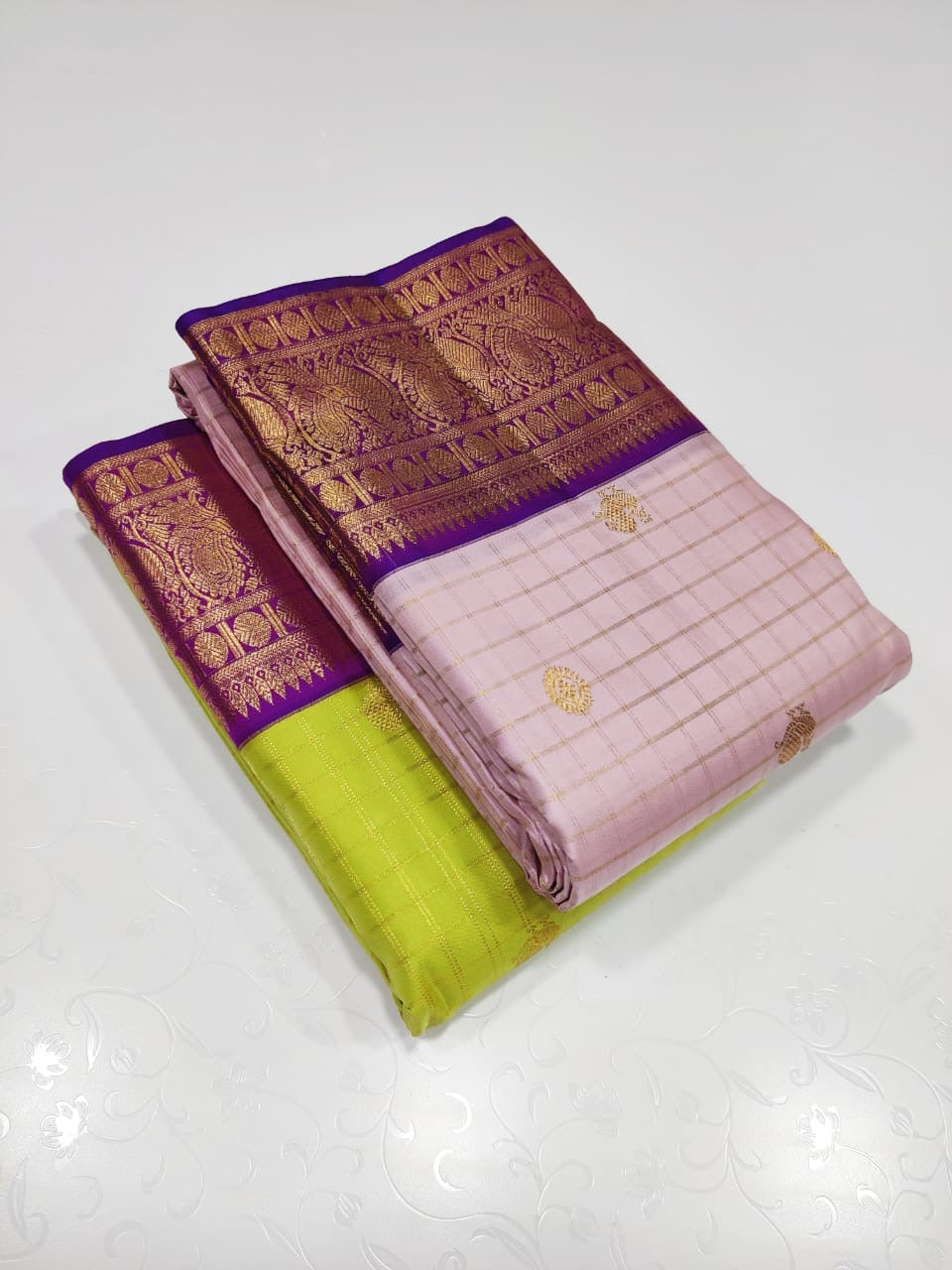 Verdant Gold ✨ – Parrot Green & Violet Pure Kanchipuram Silk Saree
 Gold Zari Buttas in Kattam Weave
Violet Korvai Border with Peacock & Floral Zari Motifs
Grand Violet Brocade Pallu with  Tassels done 
Violet Blouse with Zari Border | Silk Mark