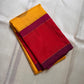 Mustard yellow silk saree fold with zari woven coin buttas and magenta border