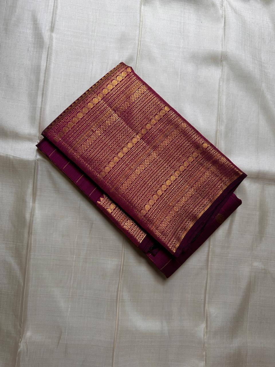 Purple with gold Zari kattam with ornate border pure silk Kanchipuram with mayil chakram zari butta and detailed Pallu