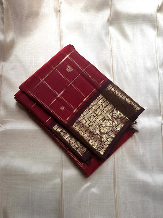 Arakku  maroon Zari kattam pure silk Kanchipuram with Zari motifs and varisaipet border and ornate palla