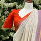 Tamara – Ivory Cream Semi-Silk Saree with Vibrant Orange Border
Paired with a Scallop Neck & Sleeve Ready-to-Wear Orange Blouse (Size 36–42)